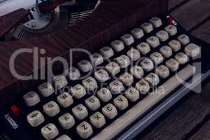 Vintage typewriter on wooden table