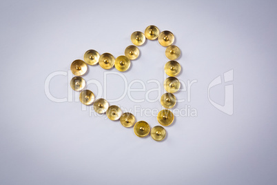 Push pins arranged in heart shape