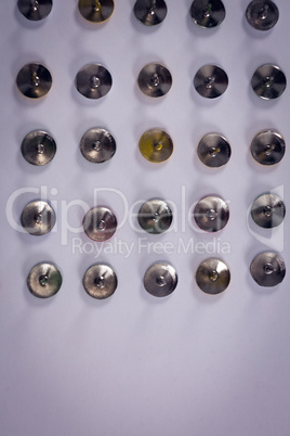 Push pins arranged in a row