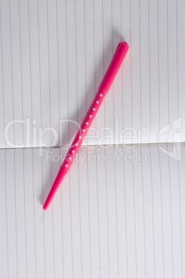 Close-up of pen on open diary