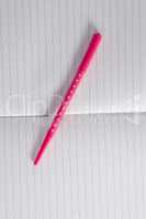 Close-up of pen on open diary
