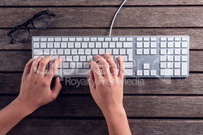 Executive typing on keyboard in office Executive typing on keyboard in office