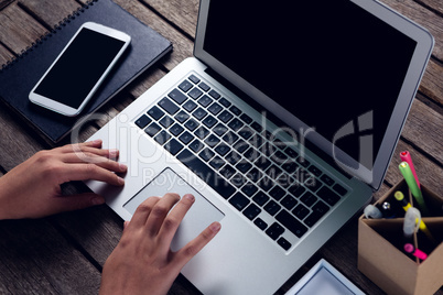 Executive using laptop at desk