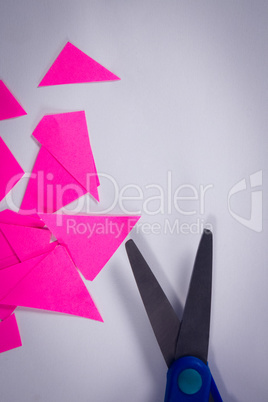 Scissors and craft paper on white background