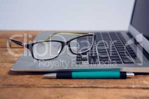 Close-up of spectacles on laptop