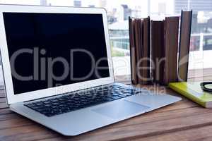 Laptop on wooden table