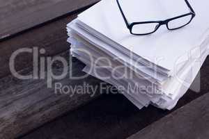 Close-up of spectacles on blank paper