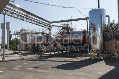 Modern aluminum barrels for wine in wine factory photo