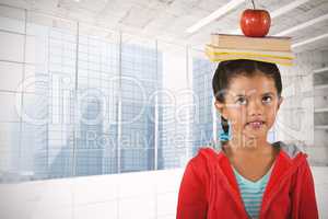 Composite image of girl balancing books and apple on head