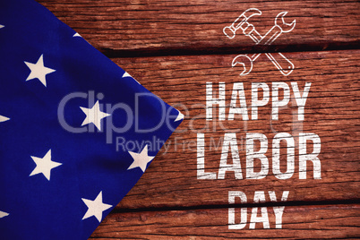 Composite image of digital composite image of happy labor day text with tools