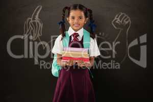 Composite image of smiling schoolgirl carrying books