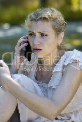 Girl talking on phone and being shocked