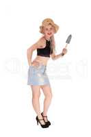 Slim woman with straw hat and small shovel