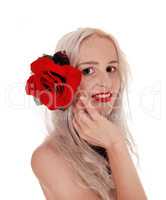 Beautiful woman in portrait with red rose