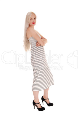Beautiful blond woman standing in profile