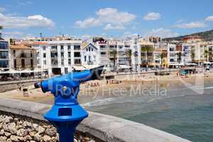 The tourists binocular near the beach, Sitges, Spain