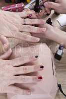 Manicurist makes manicure