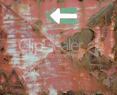 Rusty iron plate with arrow