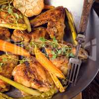 Grilled chicken wings with caramelized carrots