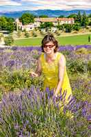 Woman in flowering lavender field