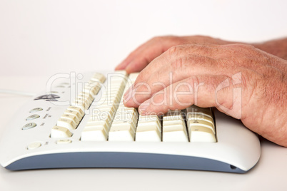 Hand on the computer keyboard