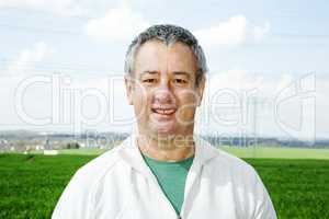 Portrait of farmer in front of his box