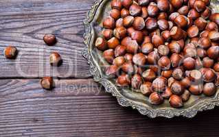 Hazelnuts on an iron plate
