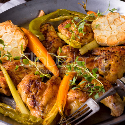 Grilled chicken wings with caramelized carrots