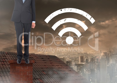 Wi-fi icon and  Businessman standing on Roof with chimney and cloudy city