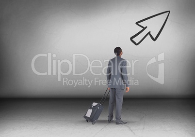 Businessman with travel bag looking up with arrow icon