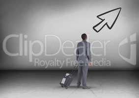 Businessman with travel bag looking up with arrow icon