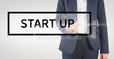 Hand interacting with start-up business text against white background