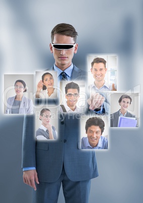 Businessman with Virtual Reality head set interacting and choosing a person from group of people int