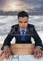 Businessman using keyboard in sea of documents under sky clouds and cityscape skyline
