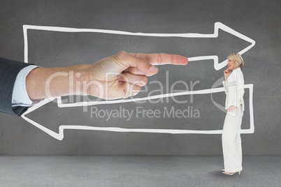 Hand pointing at business woman against grey background with arrows