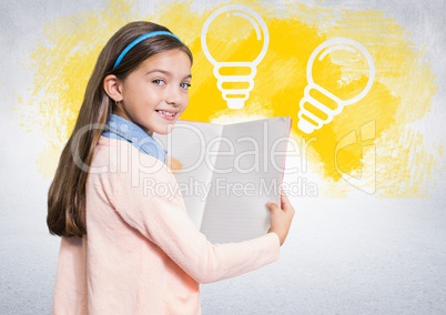 Girl reading book in front of lightbulbs