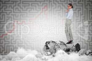 Composite image of thoughtful businesswoman standing