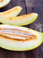 Sliced melon on a brown wooden table