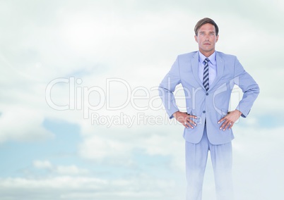 Businessman under sky clouds