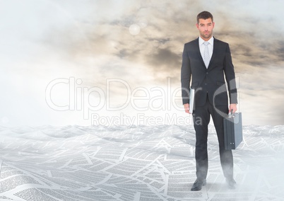 Businessman holding briefcase in sea of documents under sky clouds