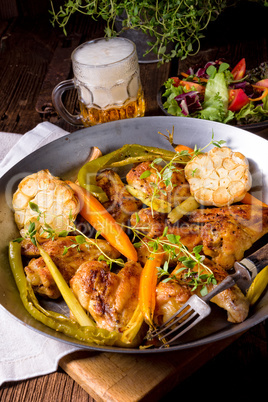 Grilled chicken wings with caramelized carrots