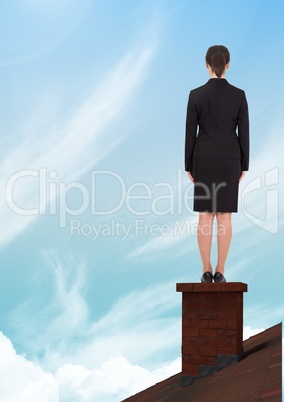 Businesswoman on roof chimney with sky