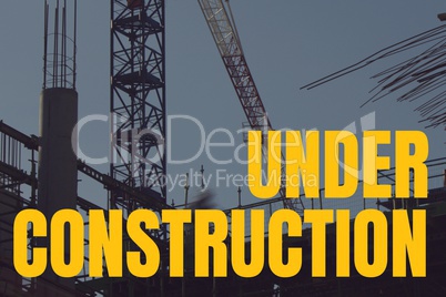 Under construction text against construction photo
