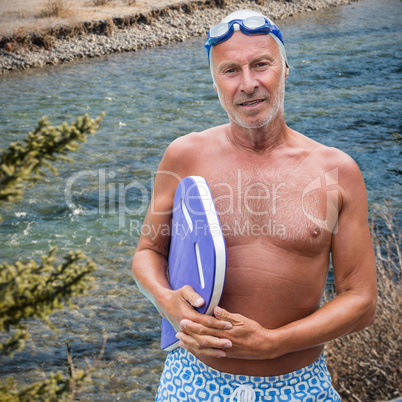 Composite image of portrait of senior male swimmer with swimming float