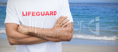 Composite image of mid section of male lifeguard