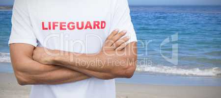 Composite image of mid section of male lifeguard