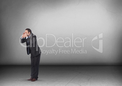 Businessman calling out in room