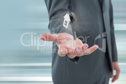 Business man holding keys