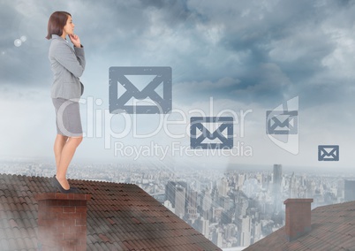 Email icons and Businesswoman standing on Roof with chimney and cloudy city