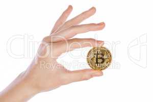 Young girl hand holding bitcoin on white